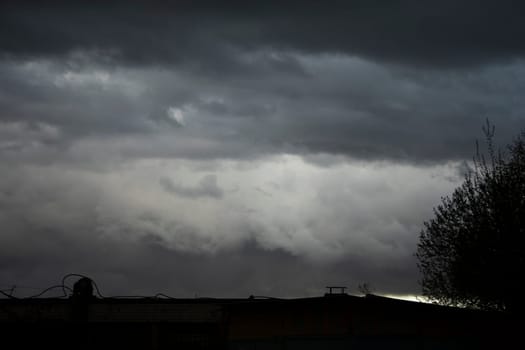 Sky is in rain. Bad weather. Grey clouds. Details of nature. Celestial landscape with storm clouds.