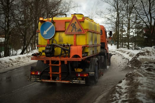 Washing vehicles on road. Special equipment for cleaning on highway. Transport with water.