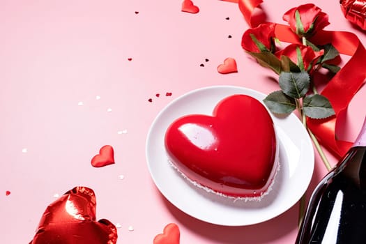 Valentines day. heart shaped glazed valentine cake and flowers on pink background, copy space