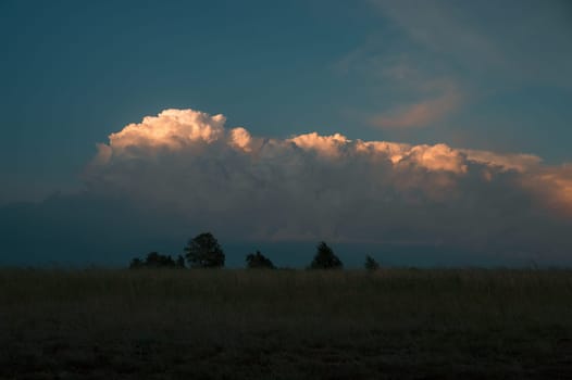 Landscape with beautiful sunset sky, summer evening