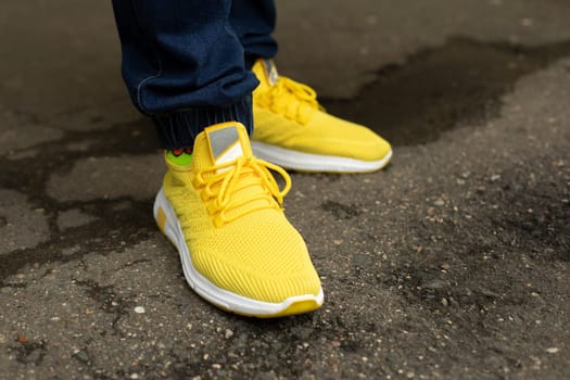 Yellow crosses. Bright shoes. Fashionable men's summer sneakers.