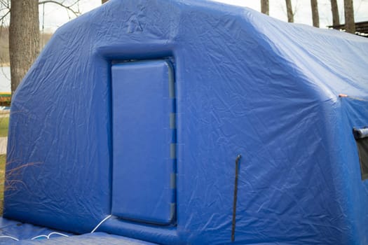 Blue portable sauna. Outdoor sauna. Inflatable room. Rubber construction.