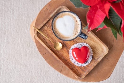 Valentines day. heart shaped glazed valentine cake and flowers