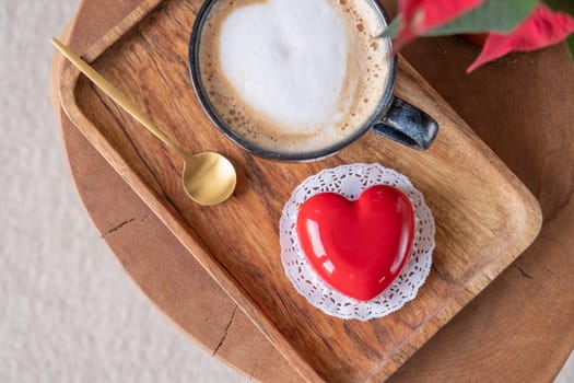 Valentines day. heart shaped glazed valentine cake and flowers