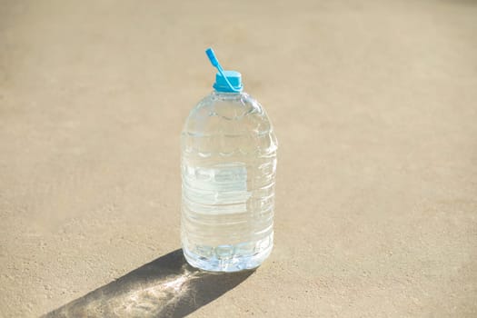 Bottle of water. Empty canister. Plastic water tank. Bottle with handle.