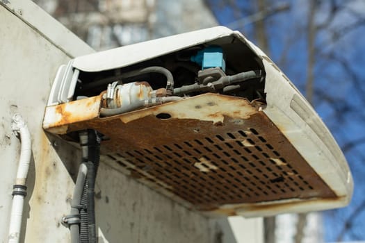 Broken refrigerator. Transport refrigerator. Cooling system is damaged. Machine parts.