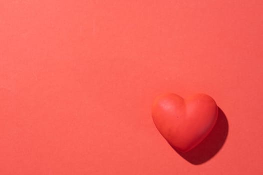 Valentines day. Red heart with copy space isolated on red background