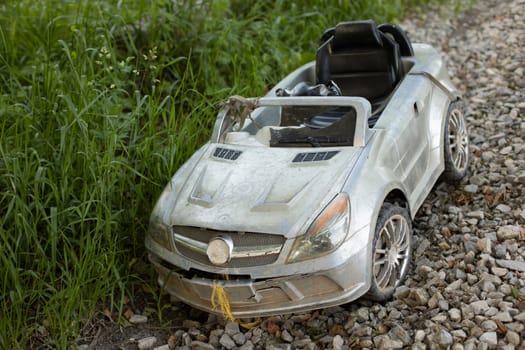 Children's car on road. Car for child. Toy toddler. Electric transport for younger student.