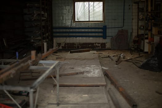 Metal in workshop. Garage for work. Steel processing. Interior of industrial building.