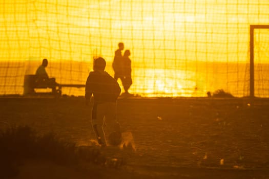 A group of people playing a game of soccer