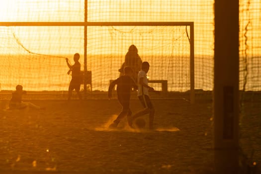 A group of people playing a game of soccer