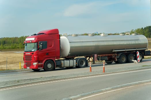 Ramigala, Lithuania - May 2, 2023: Transportation of liquid chemical products by road along the highway. Logistics concept.
