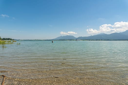 Serene Lake Chiemsee with Boaters and Alpine Backdrop