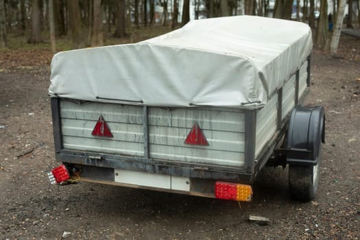 Trailer for car. Cart on wheels. Transport for transportation of light loads.