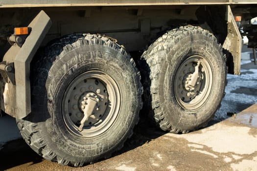 Truck wheels. Truck parts. Large wheels. Machine for transportation of building material.