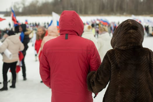 People in winter in Russia. Winter walk. Warm clothes in cold. Winter holiday at Russians.