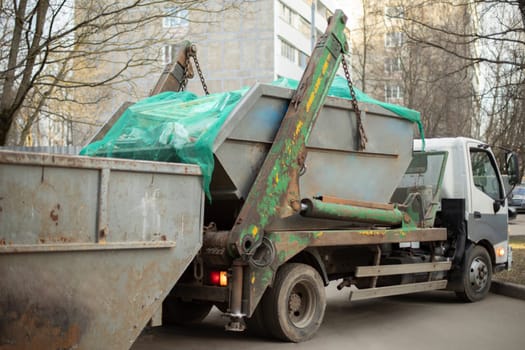 Garbage collection. Transport for collection of containers with waste. Tank loader.