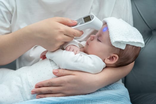 Mother showcases love and concern by measuring her newborn's forehead temperature with an up-to