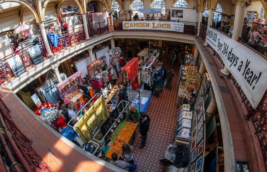 London, United Kingdom - April 01, 2007: Extreme wide angle (fisheye) photo of stalls with jewellery, cosmetics and other accessories on display at Camden Lock, famous flea market in UK capital.