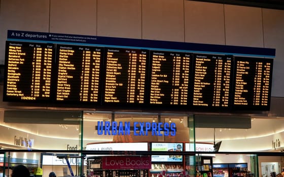 London, United Kingdom - February 01, 2019: Train departures board over Urban Express convenience store entrance at London Bridge station. It is 4th busiest in UK capital, serving 50 million annually