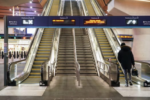 London, United Kingdom - February 01, 2019: Empty escalators and stairs, only one anonymous passenger going up at London Bridge underground station. It is 4th busiest in UK capital