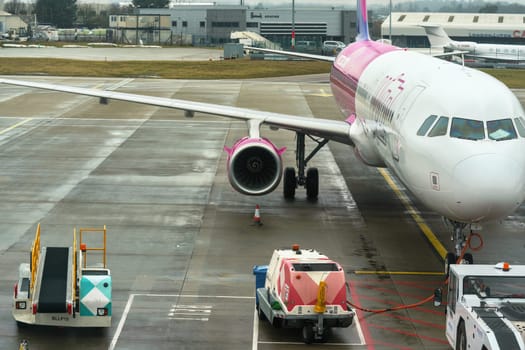 London, United Kingdom - February 05, 2019: WizzAir's Airbus A320 waiting at London Luton airport on overcast day, Wizz Air is Hungarian low cost operator founded in 2003