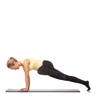 Woman, pilates and mat in studio for push ups, fitness or workout for healthy body, wellness or core muscle. Person, exercise or yoga on floor for abdomen health on mockup space or white background.