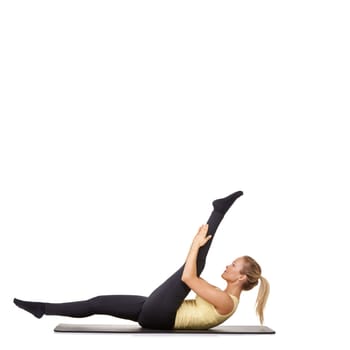 Woman, legs and stretching on yoga mat for gym flexibility, mockup space or white background. Female person, challenge and healthy wellness in studio for progress, splits practice or pilates training.