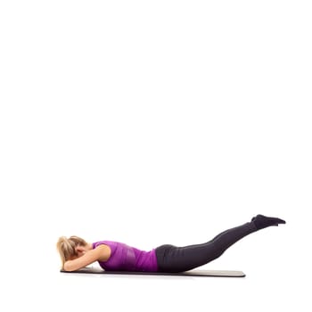 Woman, legs and glutes on yoga mat in studio for pilates performance, mockup space or white background. Female person, stretching and wellness progress exercise for training, challenge or healthy.