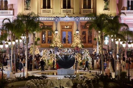 Monaco, Monte-Carlo, 12 November 2022: The Indian wedding celebration in the square of the famous Casino Monte-Carlo is at night, attraction night illumination. High quality photo