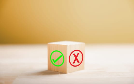 Wooden block presents green check mark and red x symbolizing decision making. Choice concept. Think With Yes Or No Choice.