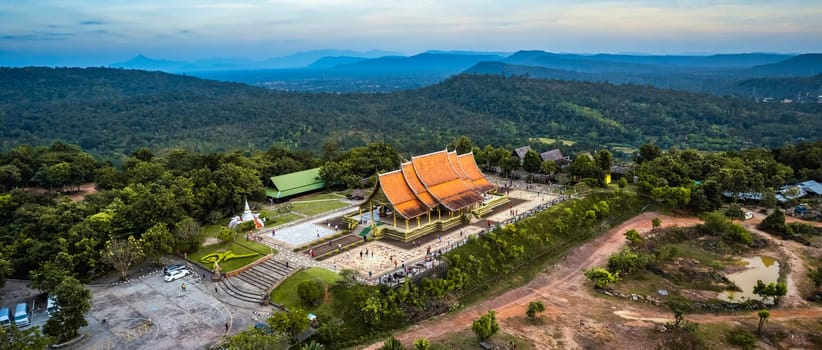 Aerial view of Wat Sirindhorn Wararam glowing temple in Ubon, Thailand, south east asia