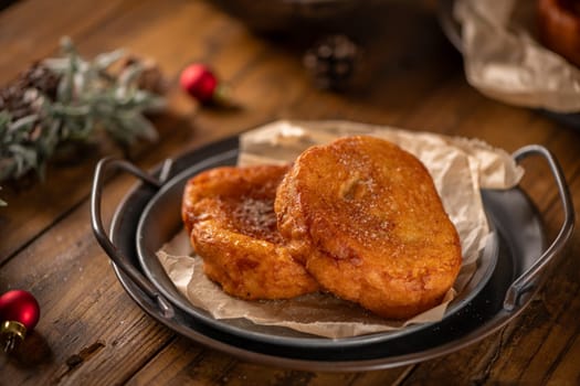 Traditional Portuguese Christmas Rabanadas. Spanish Torrijas on kitchen countertop.