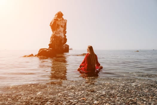 Woman travel sea. Happy tourist taking picture outdoors for memories. Woman traveler looks at the edge of the cliff on the sea bay of mountains, sharing travel adventure journey.