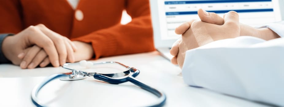 Couple attend fertility or medical consultation with gynecologist at hospital as family planning care for pregnancy. Husband and wife consoling each other through doctor appointment. Panorama Rigid