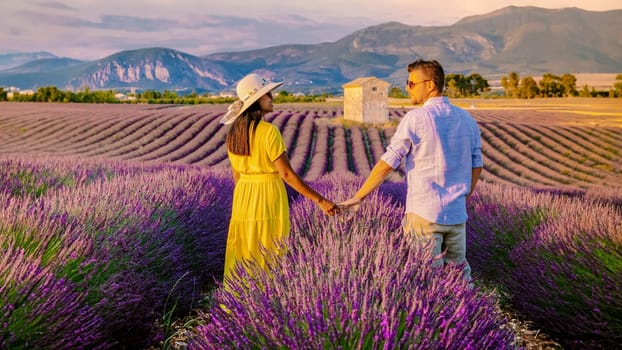 Provence, Lavender field France, Valensole Plateau, a colorful field of Lavender Valensole Plateau, Provence, Southern France.Couple of men and women on vacation in Southern France