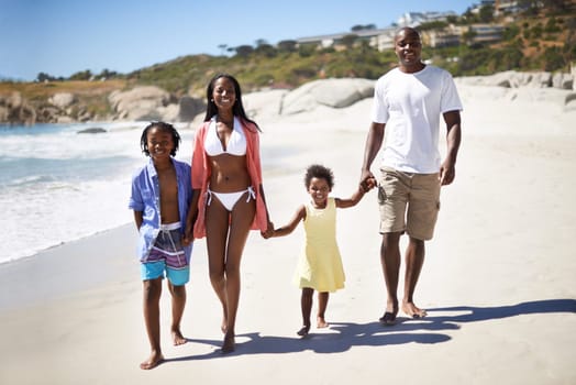 Black family, parents or children and holding hands at beach for adventure, holiday or vacation in summer. African people, face and smile outdoor in nature for experience or bonding and relationship.