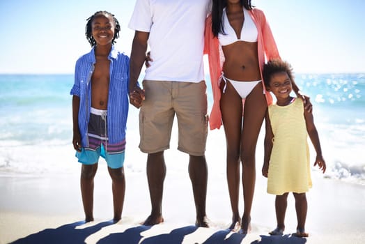 Black family, parents and kids with portrait at beach for adventure, holiday and vacation in summer. African people, face and smile outdoor in nature for break, experience or bonding and relationship.