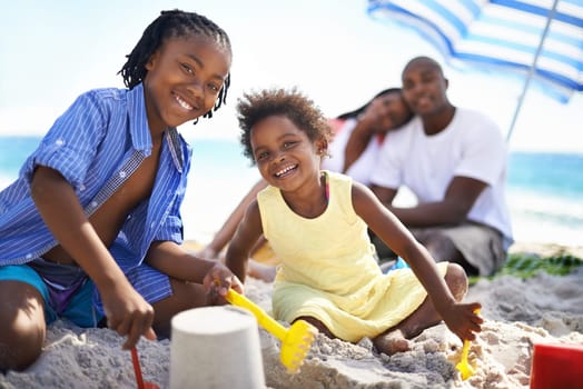 Black kids, family or playing in sand and happy at beach for adventure, holiday or vacation in summer. African people, face or smile outdoor in nature for break, experience or bond and relationship.