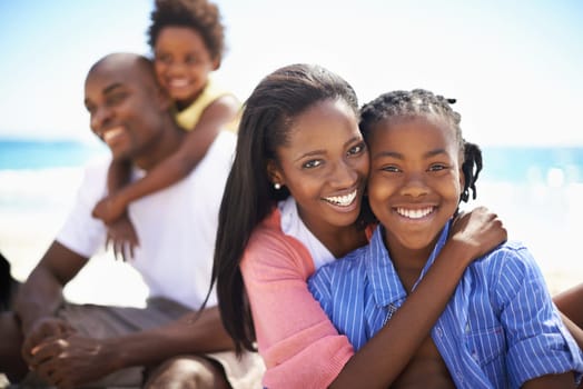African family, parents or children and hugging at beach for adventure, holiday or vacation in summer. Black people, face or smile outdoor in nature for embrace, experience or bond and relationship.