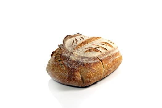 A fresh loaf of crusty sourdough bread isolated on white background