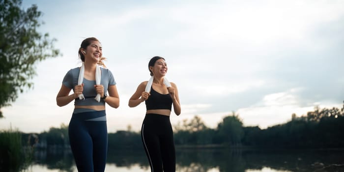 Healthy and active lifestyle, sport concept. Attractive ecstatic young sportswoman, smiling joyfully as jogging, sprinter run in park.