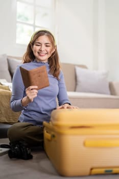 Woman packing suitcase for a new journey packing list for travel planning. prepare vacation. traveling.