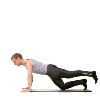 Man, pilates and mat in studio for stretching legs, fitness or workout for healthy body, wellness or core muscle. Person, exercise or yoga on floor for abdomen on mockup space or white background.