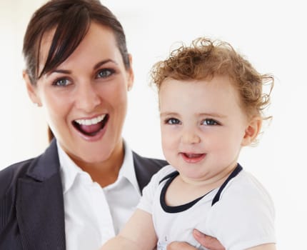 Happy, baby and mom in portrait with business, work and motherhood with a professional career. Mockup, space and woman in a suit smile with love, care and playing with child in home or morning.