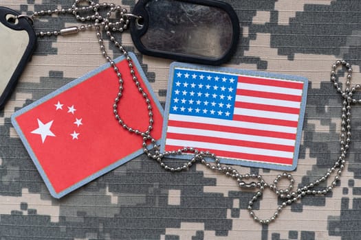 army blank, dog tag with flag of united states of america and vietnam on the khaki texture background. military concept. High quality photo