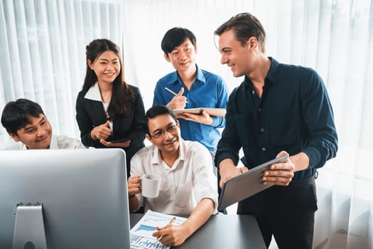 Group of diverse office worker employee working together on strategic business marketing planning in corporate office room. Positive teamwork in business workplace concept. Prudent