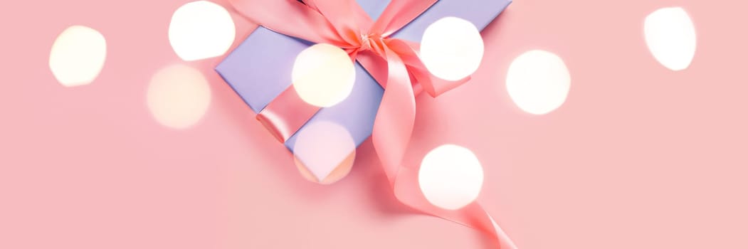 Greeting web banner with blue gift box. Pink bows. Space for your text.