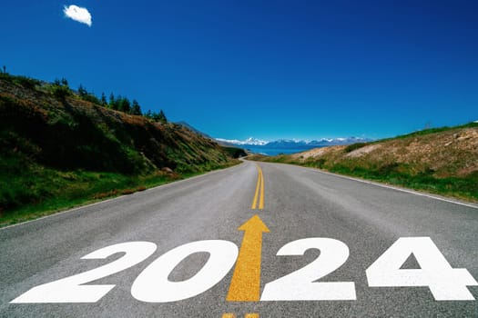 2024 New Year road trip travel and future vision concept . Nature landscape with highway road leading forward to happy new year celebration in the beginning of 2024 for bliss and successful start .