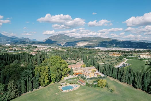 Villa Cordevigo with a swimming pool in a green park. Italy. Drone. High quality photo